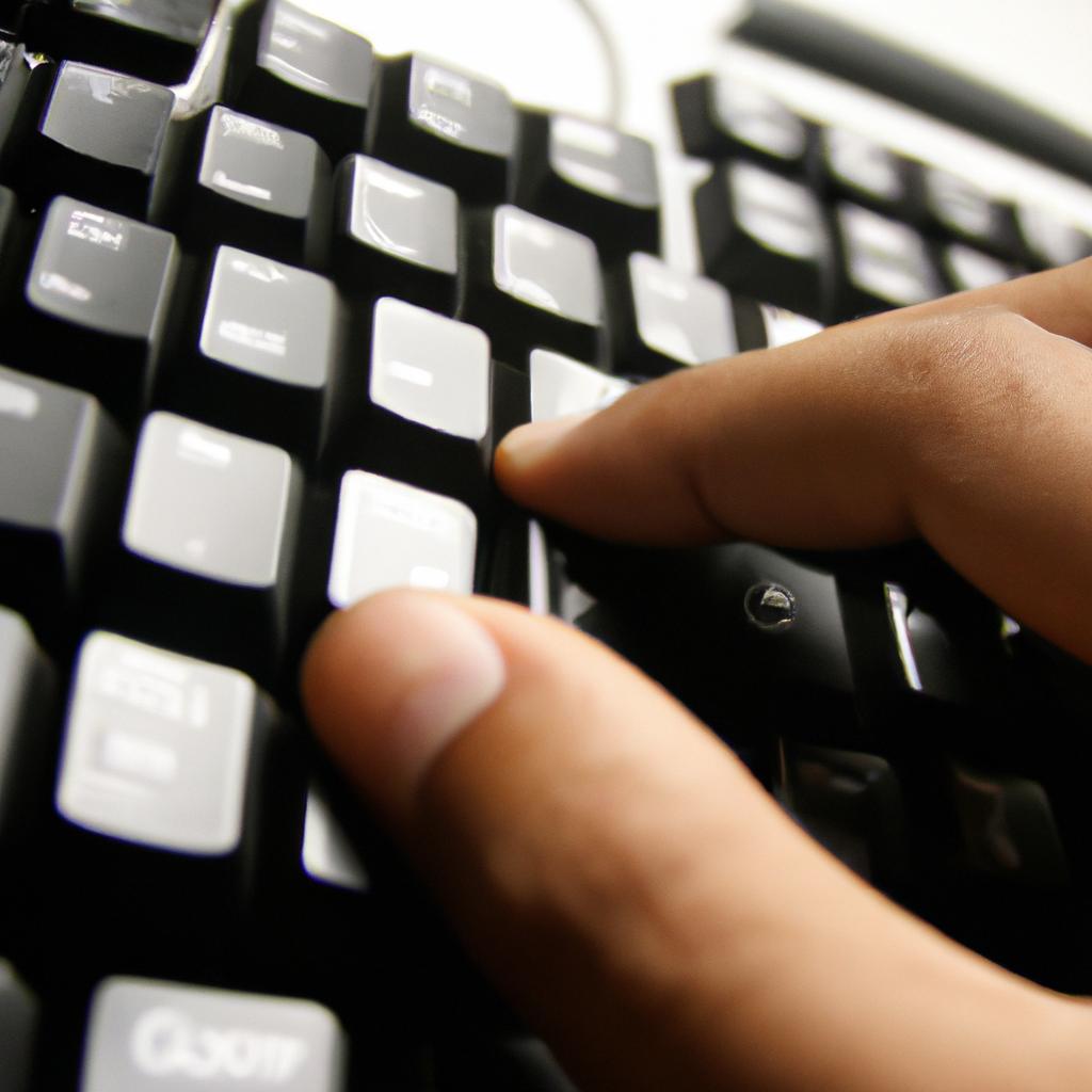 Person using computer keyboard shortcuts